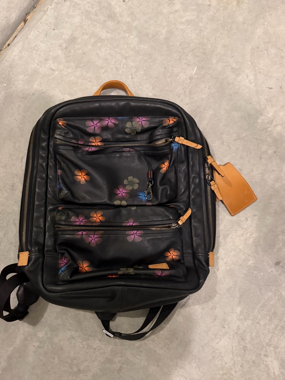 Tumi Black Backpack with Multicolor Floral Print and Tan Accents